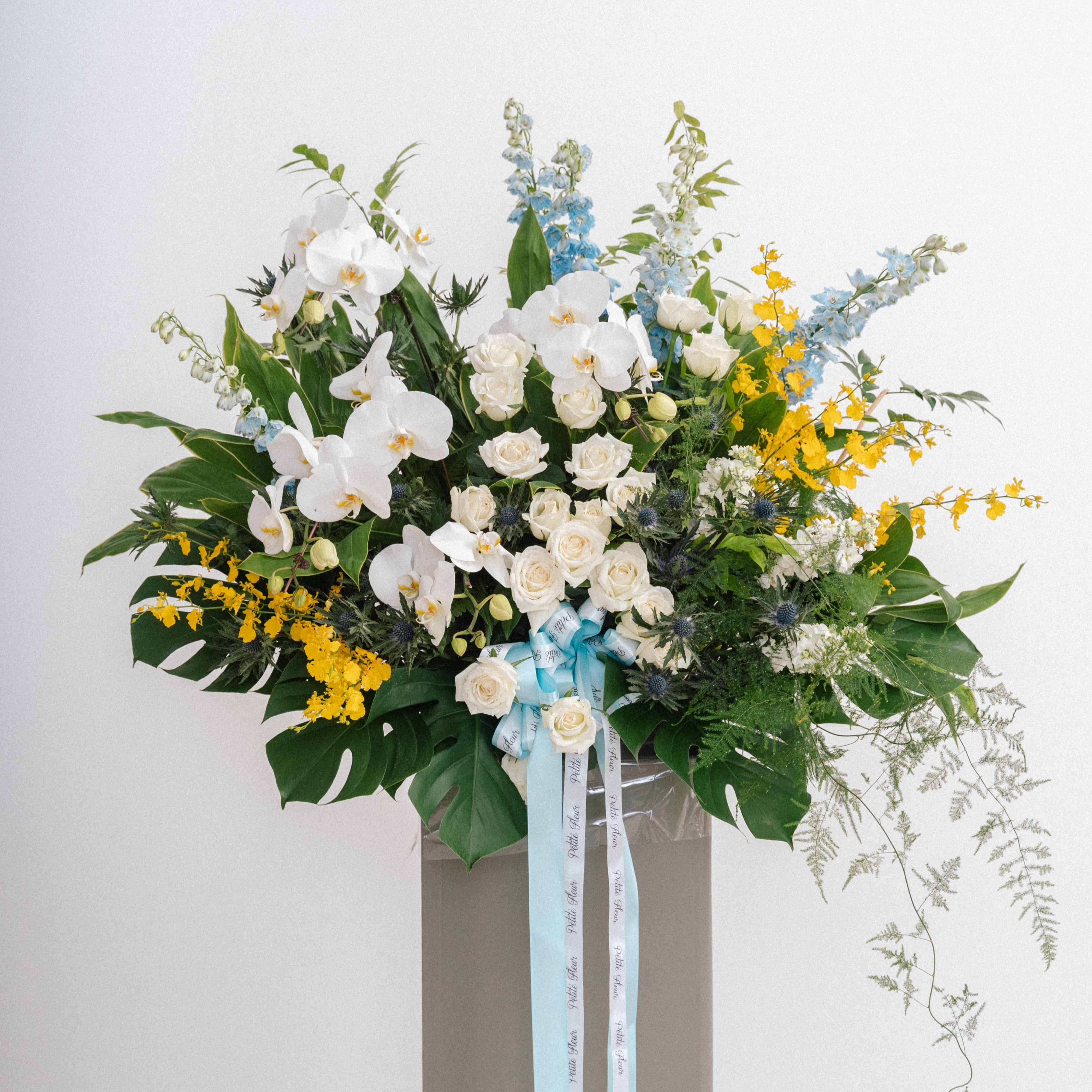 Lush Delphinium And Orchid Floral Stand