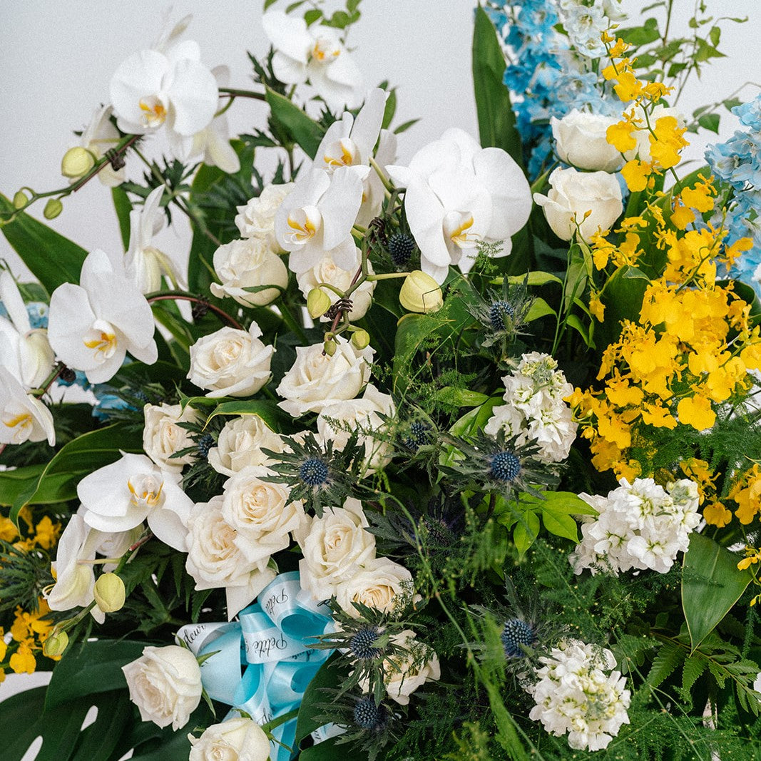 Lush Delphinium And Orchid Floral Stand