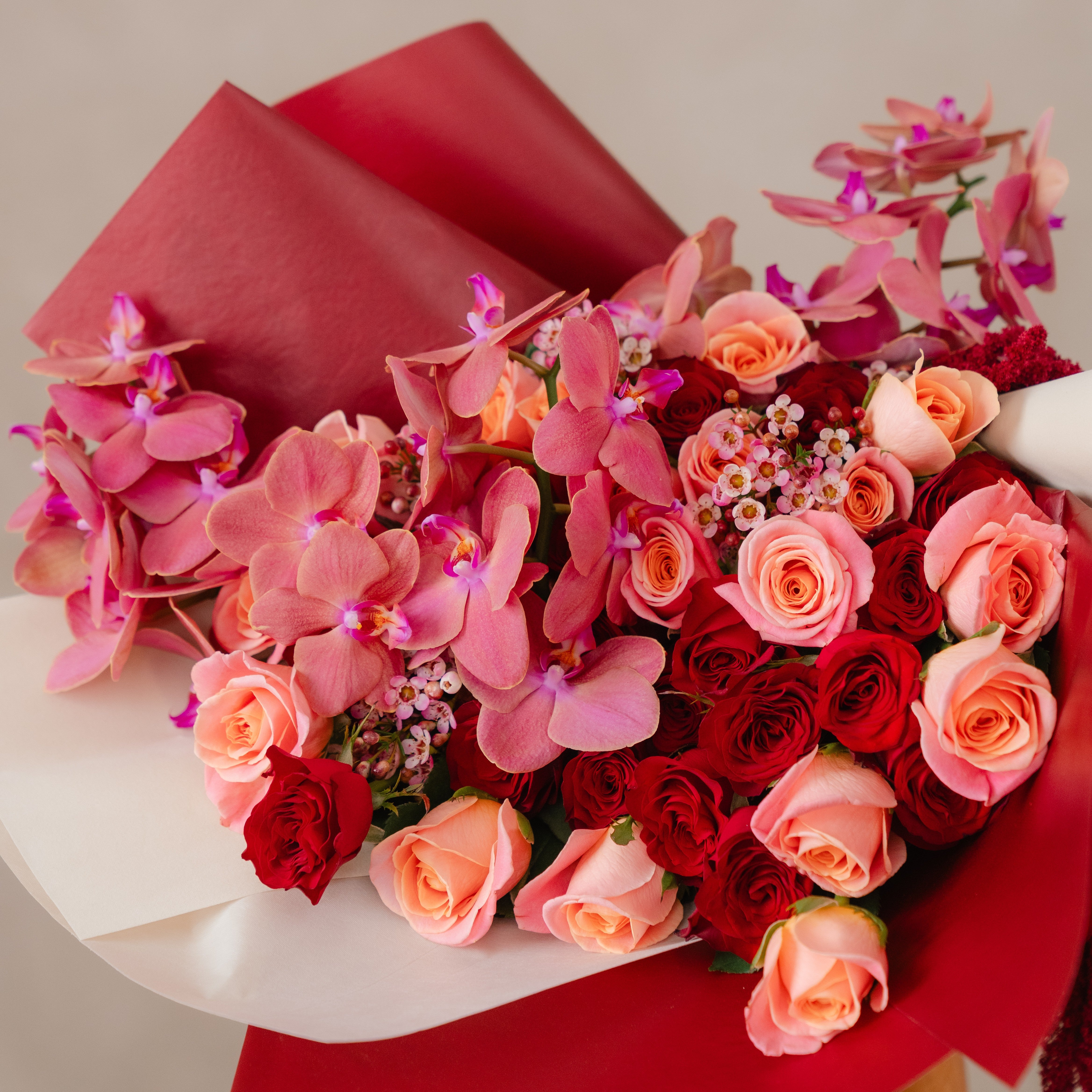 Crimson Elegance – Signature Orchid & Rose Bouquet