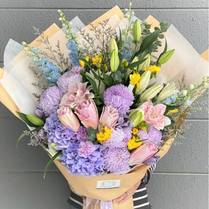 Double Petaled Lily And Delphinium Bouquet